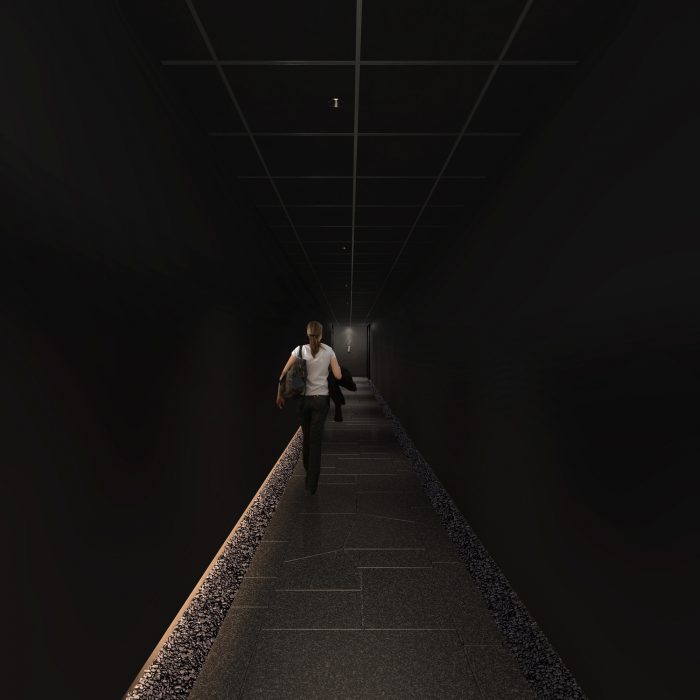 エントランスから始まる暗い石畳の回廊